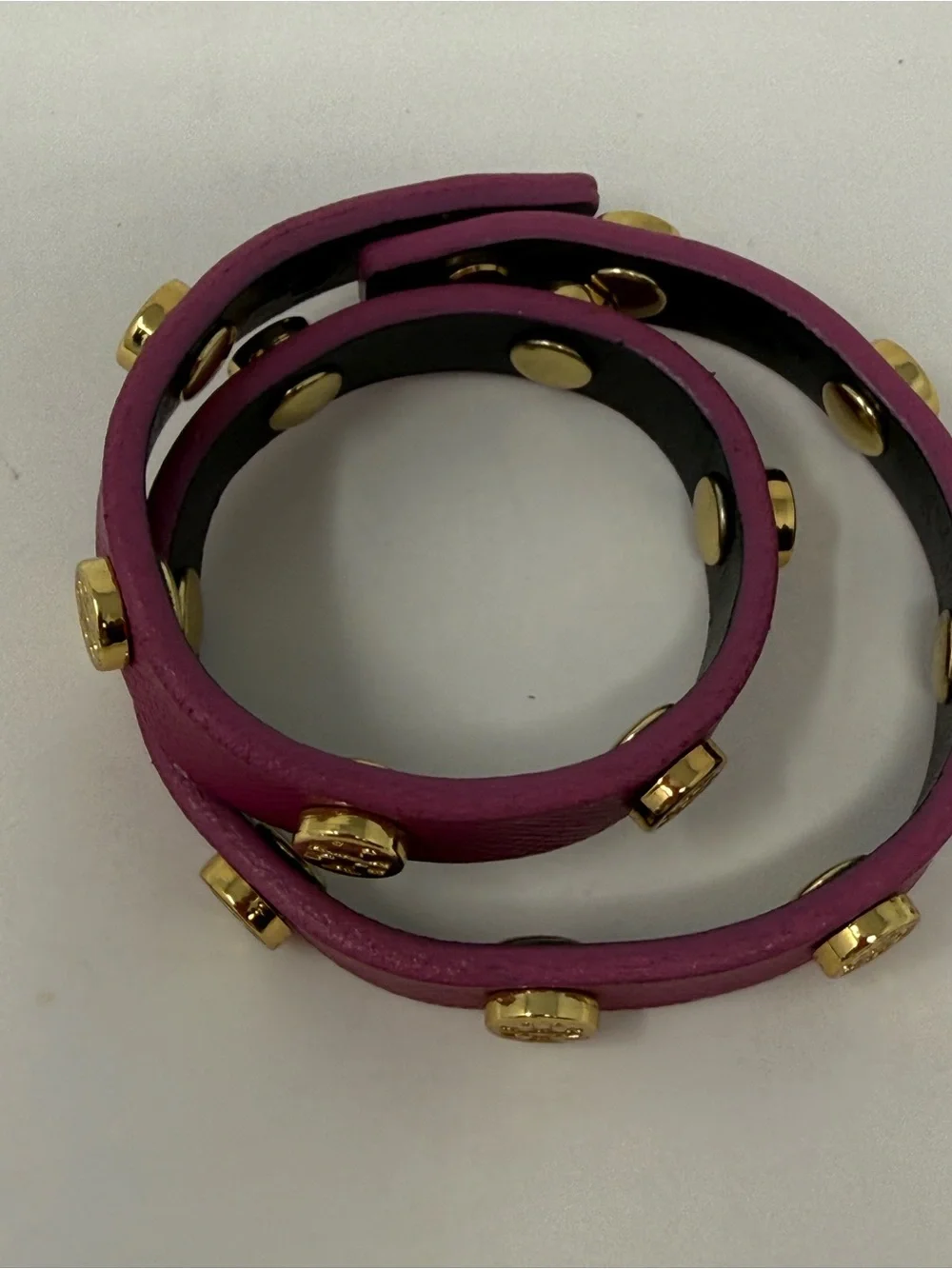 Magenta Tory Burch double-wrap leather bracelet accented with gold-tone logo